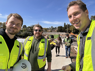 A photo of the Constructable team visiting a job site wearing their safety gear